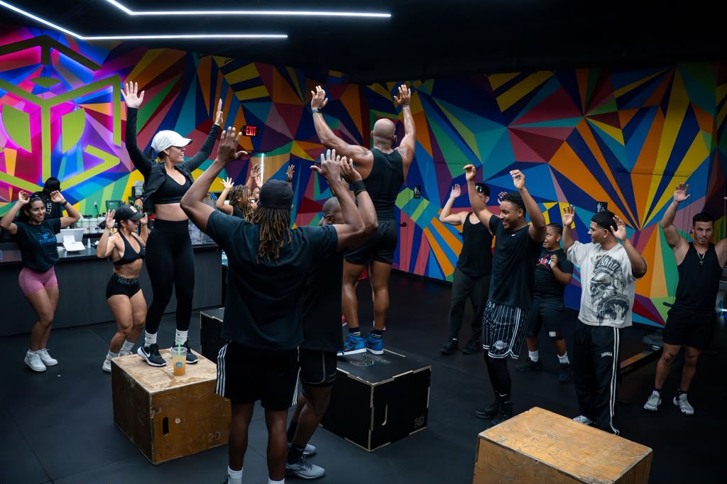 Training day in front of the gym mural