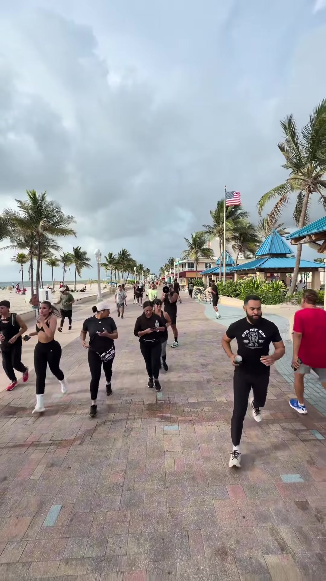 The club running together on the boardwalk